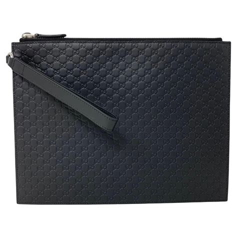 gucci small black clutch|Gucci guccissima clutch.